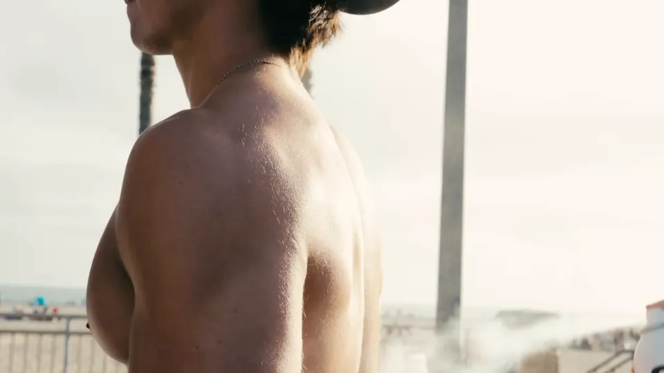 A person applying Suriss sunscreen at the beach